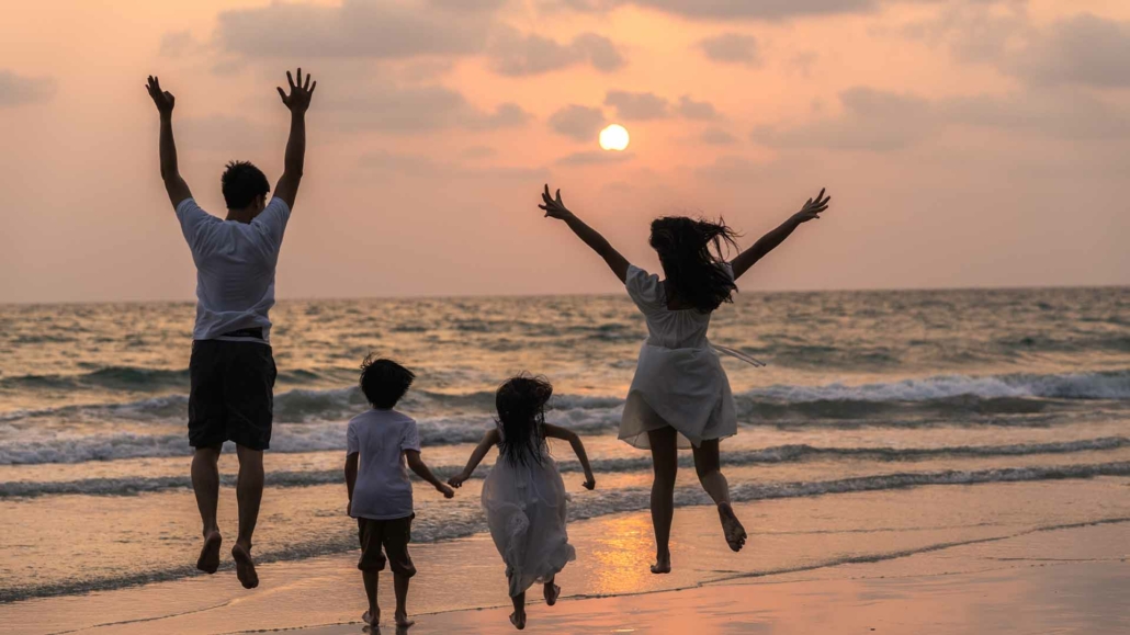 Family enjoying a beach day in Malta, a short distance from Valletta and Grand Hotel Excelsior.